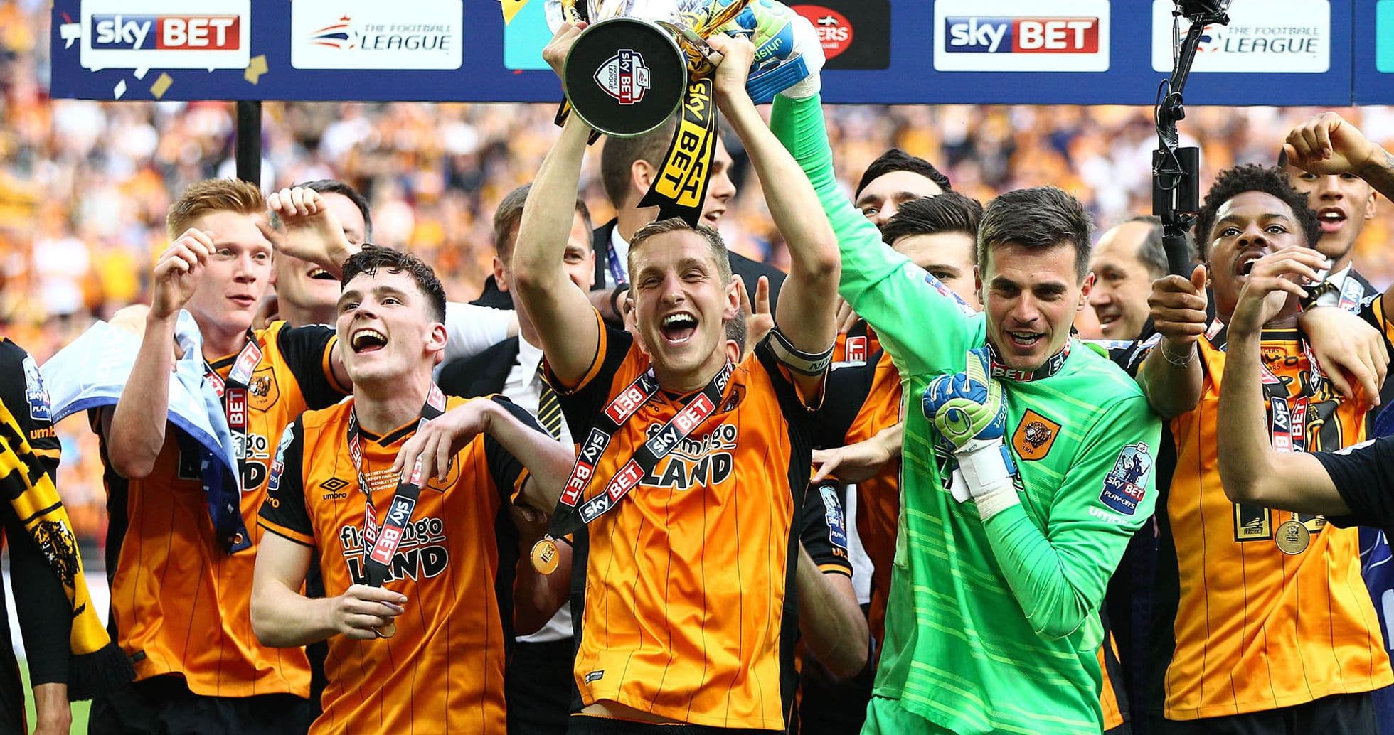 Hull City players celebrating with trophy after victory Hull City players celebrating with trophy after victory