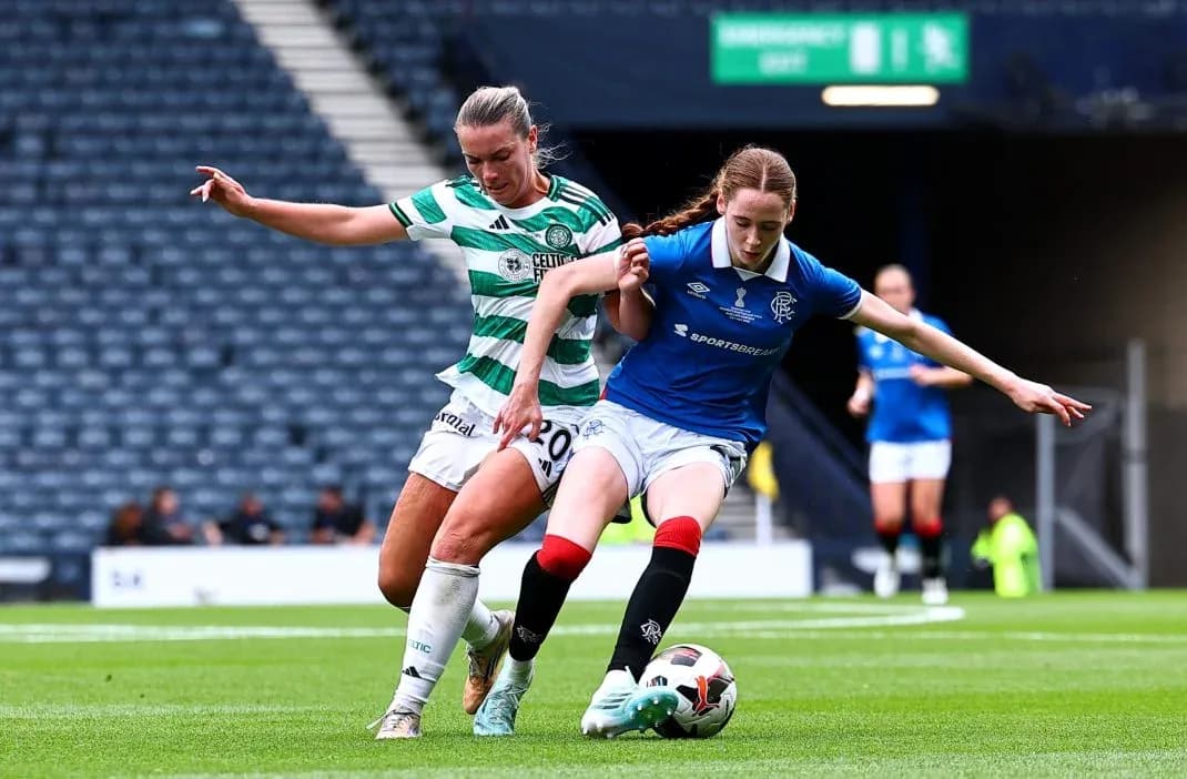 Celtic and Rangers players contesting possession of the ball Celtic and Rangers players contesting possession of the ball
