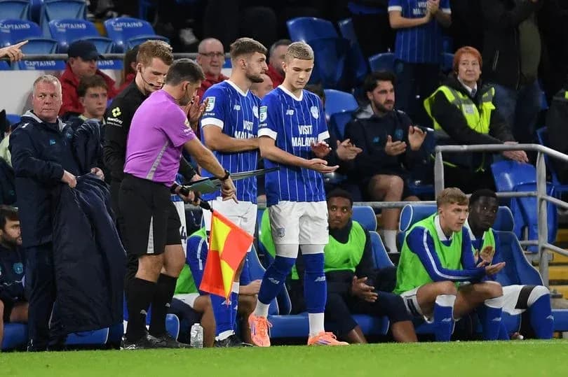 Player preparing to substitute during football match Player preparing to substitute during football match