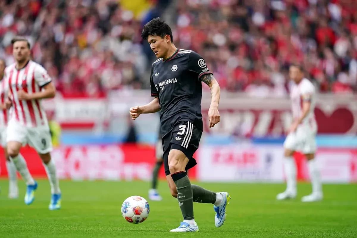 Player dribbling the ball during a match Player dribbling the ball during a match