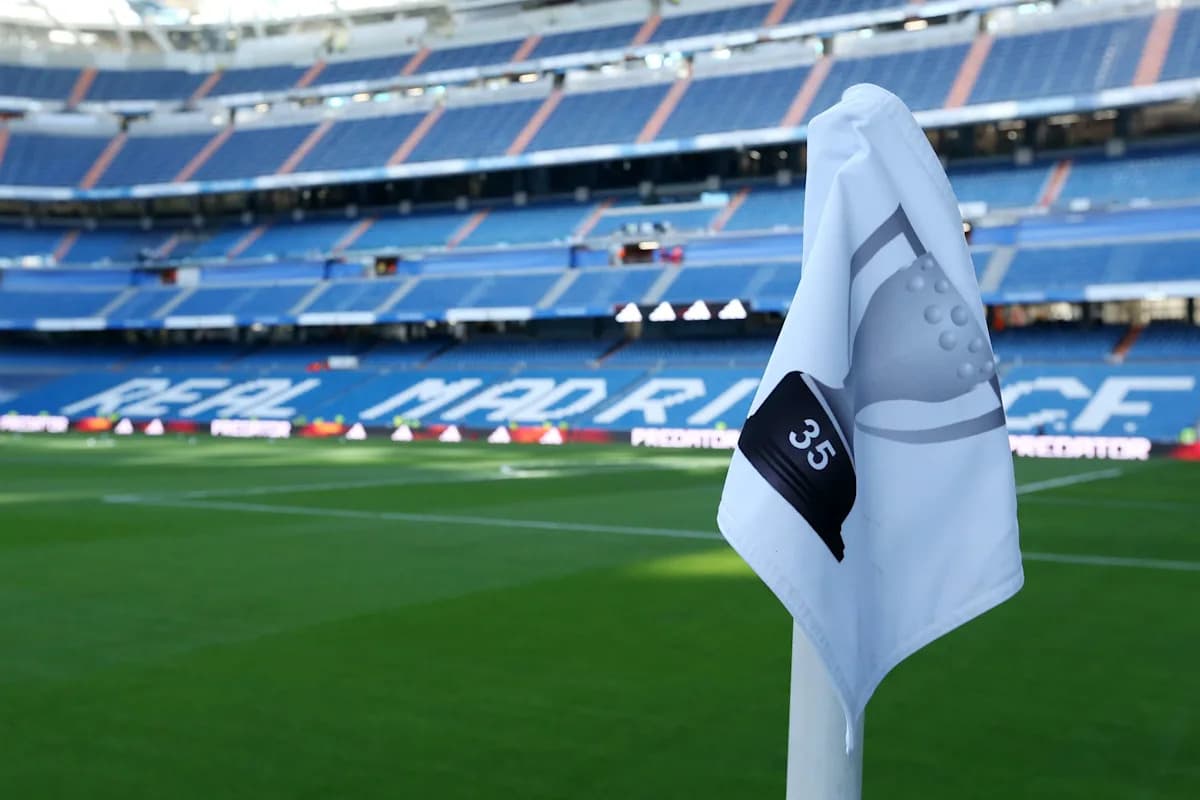 Real Madrid stadium corner flag with seating in background Real Madrid stadium corner flag with seating in background