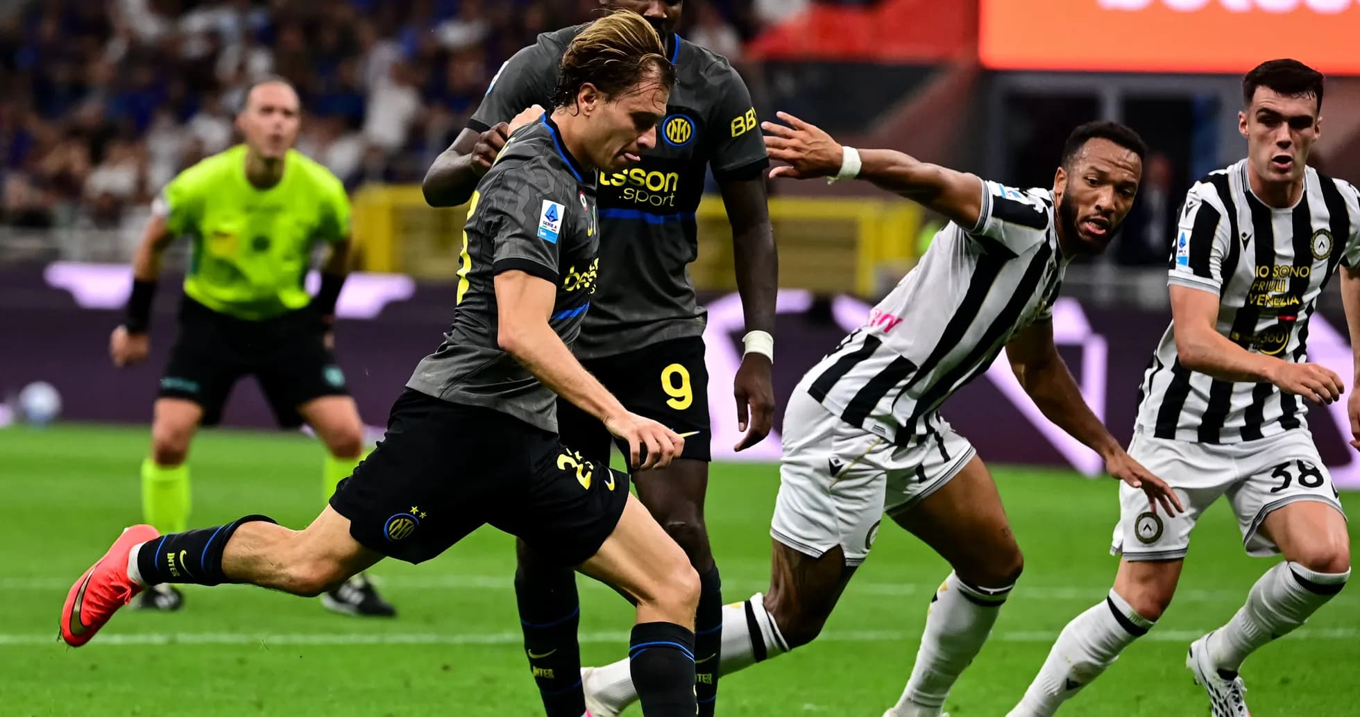 Player from Inter Milan dribbling past Udinese defenders Player from Inter Milan dribbling past Udinese defenders