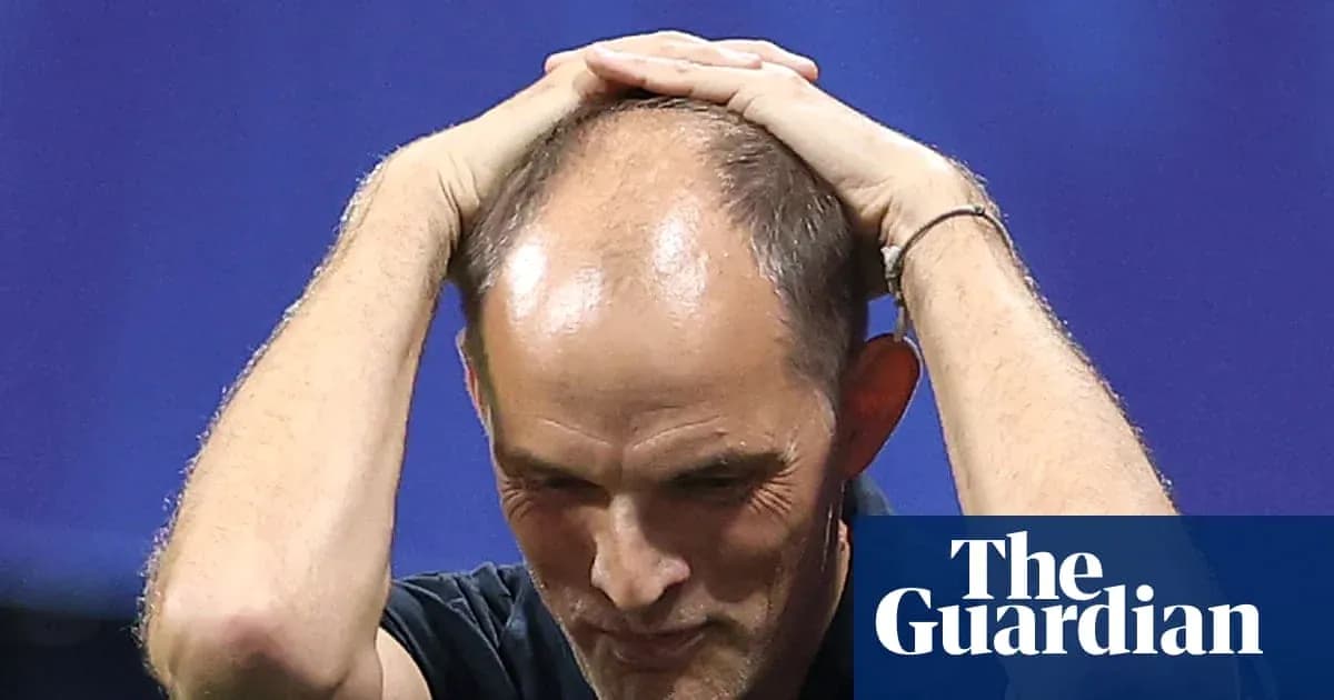 Coach holding head in apparent frustration during match Coach holding head in apparent frustration during match