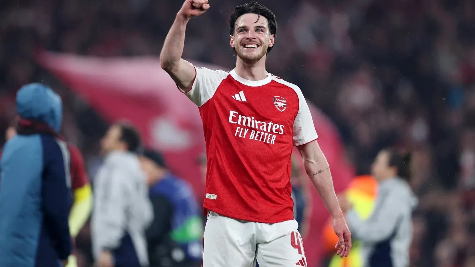 Arsenal player celebrating after a match victory Arsenal player celebrating after a match victory