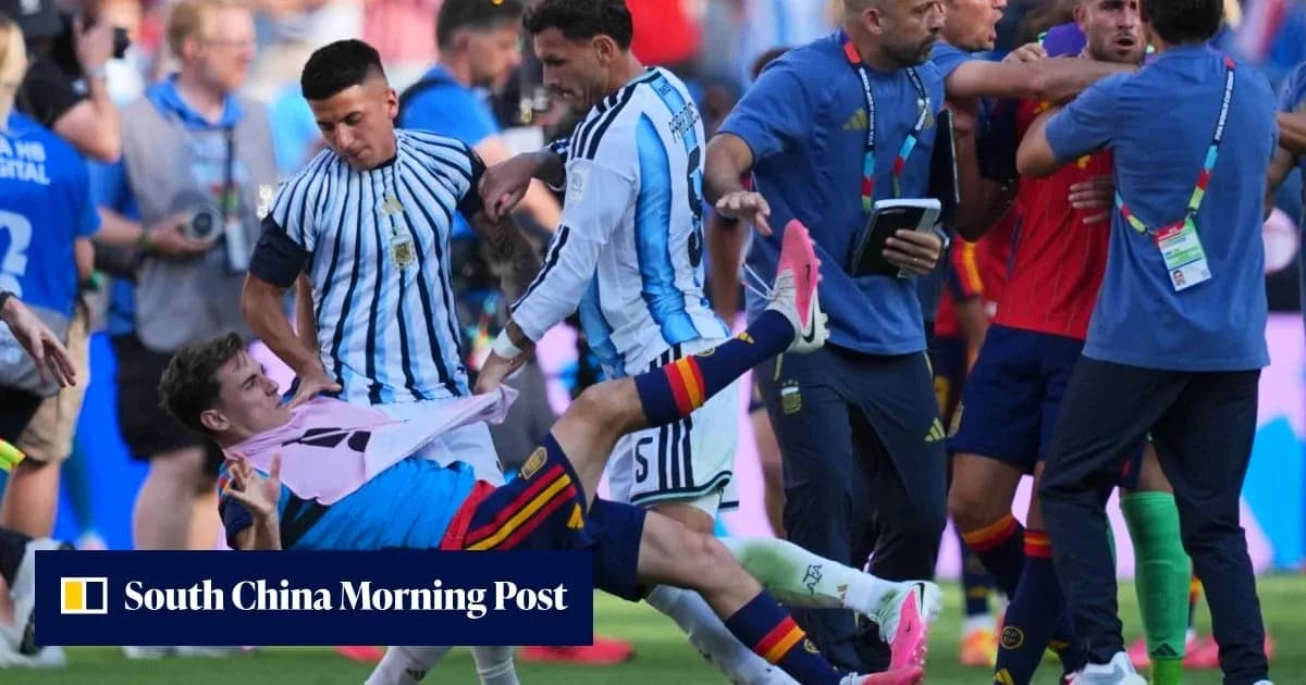 Players from Argentina and Spain in a scuffle Players from Argentina and Spain in a scuffle