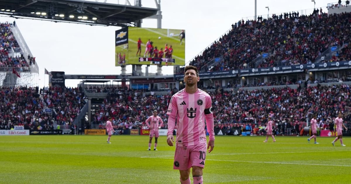 Lionel Messi on field during match with fans Lionel Messi on field during match with fans