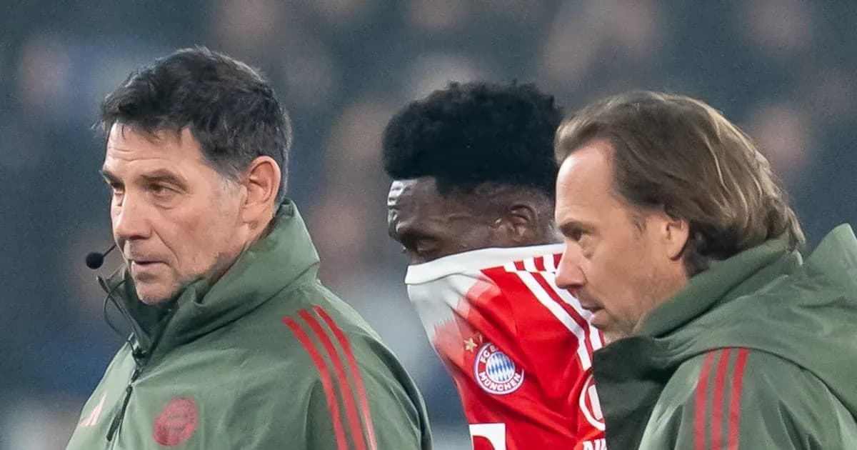Bayern Munich staff assisting player during match Bayern Munich staff assisting player during match