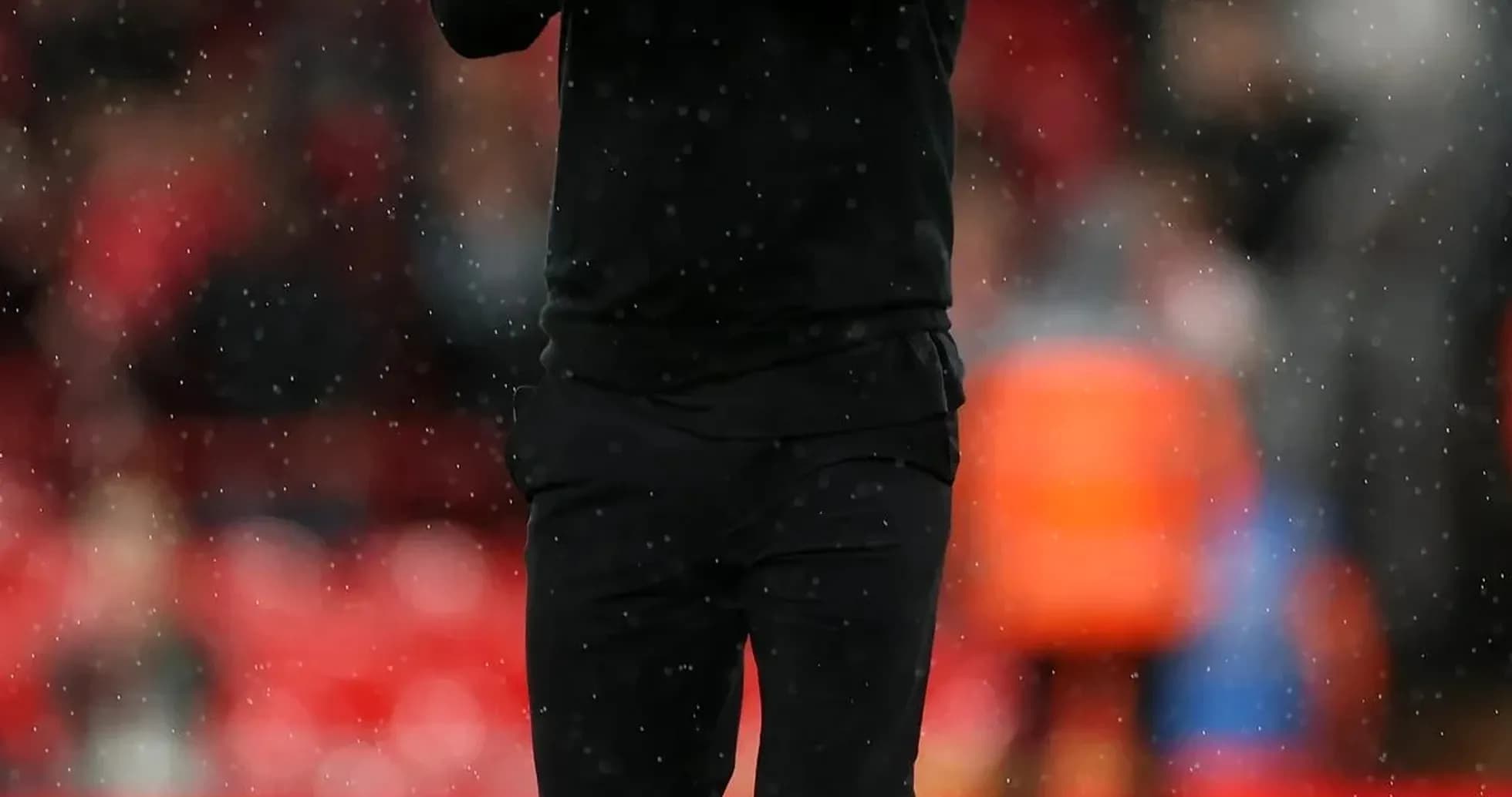 Coach applauding on the pitch during a match Coach applauding on the pitch during a match