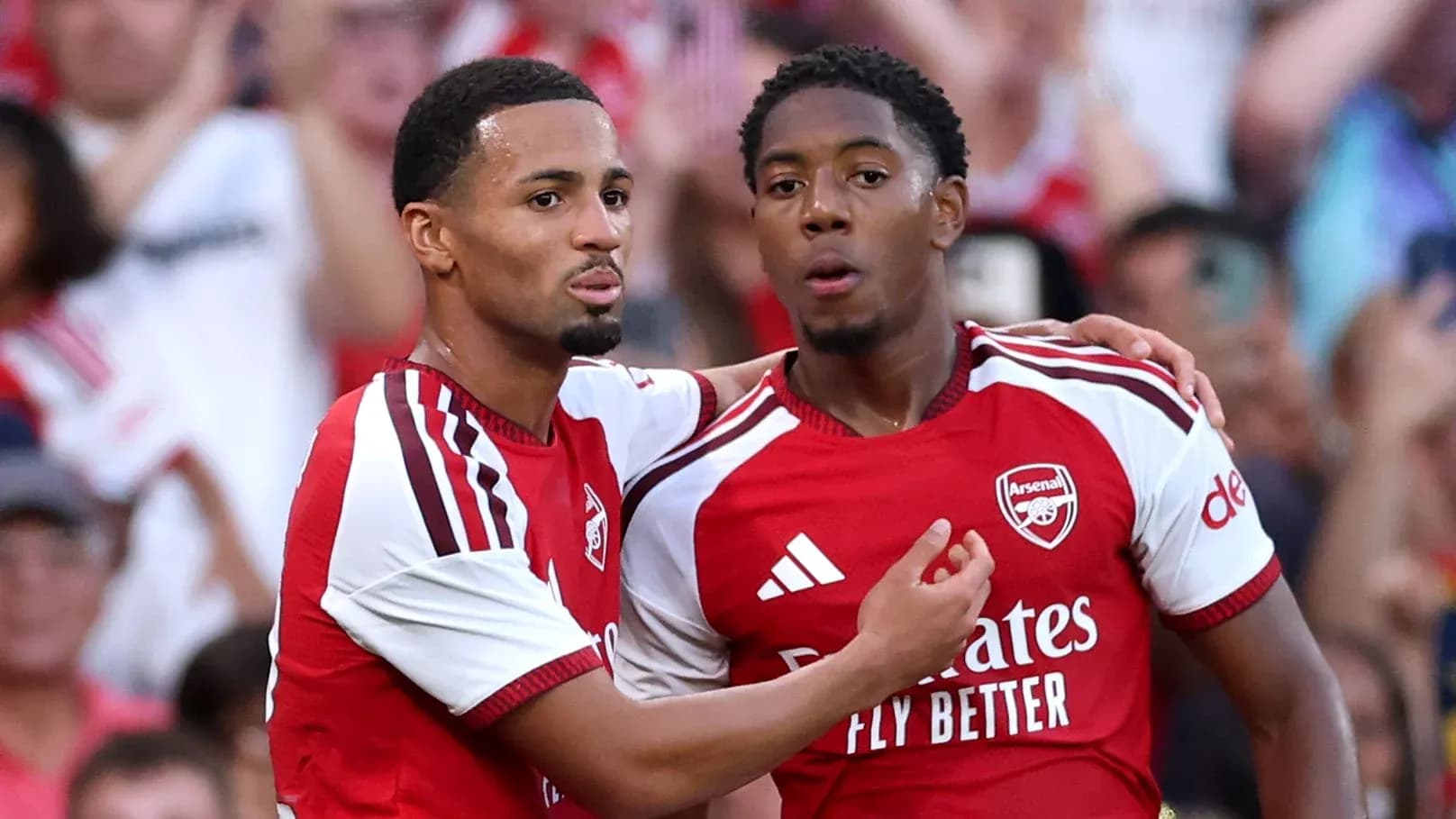 Arsenal players celebrating a goal on the field Arsenal players celebrating a goal on the field