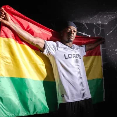 Athlete holding Bolivian flag in celebration Athlete holding Bolivian flag in celebration