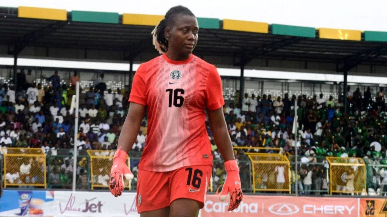 Goalkeeper in red kit walking off the field Goalkeeper in red kit walking off the field