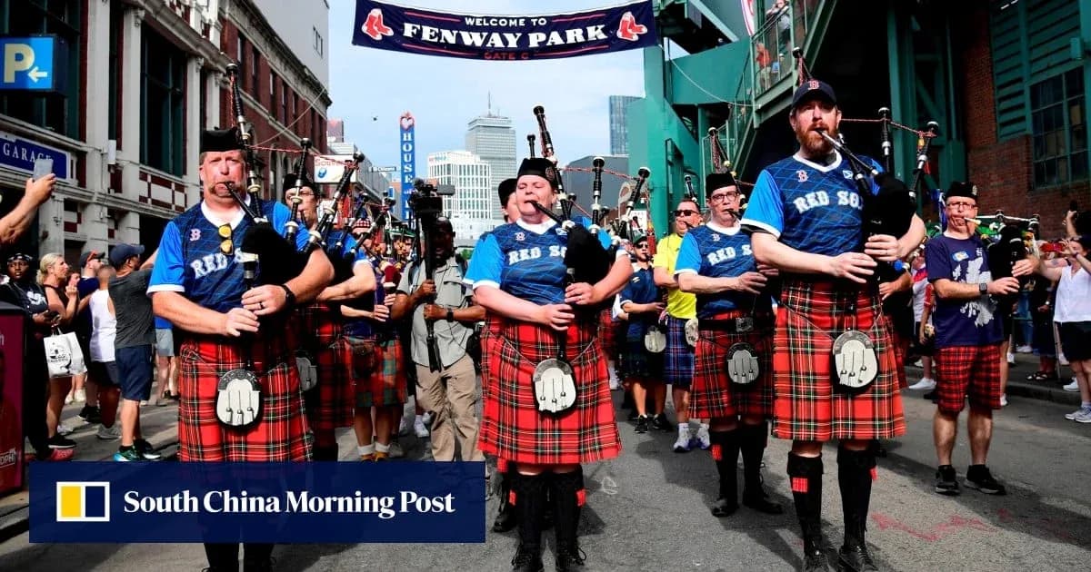 Bagpipe players in kilts marching outside Fenway Park Bagpipe players in kilts marching outside Fenway Park