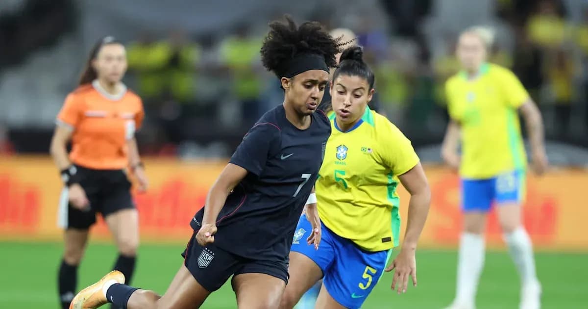 US and Brazilian players competing for the ball US and Brazilian players competing for the ball