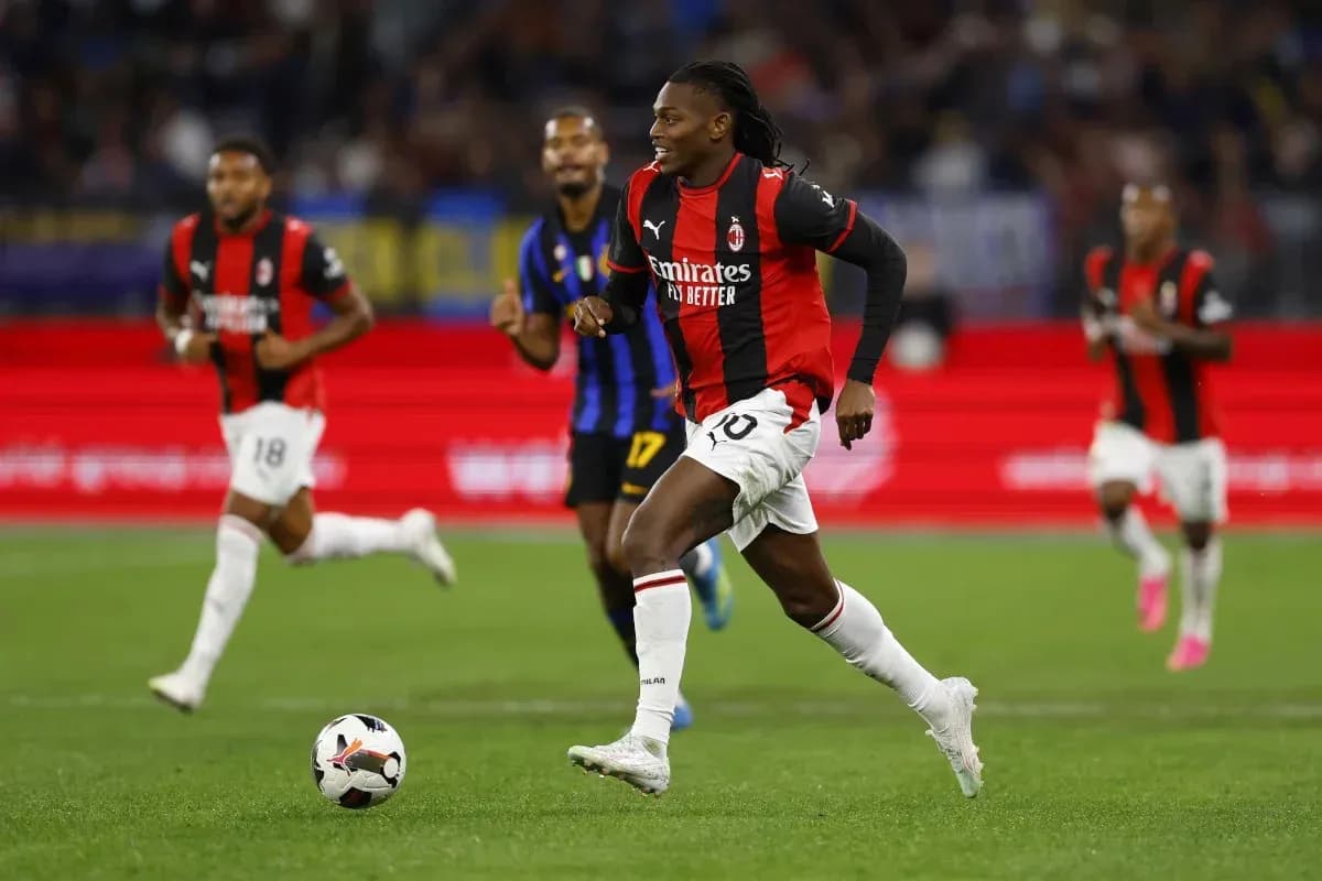 AC Milan player sprinting with ball during match AC Milan player sprinting with ball during match
