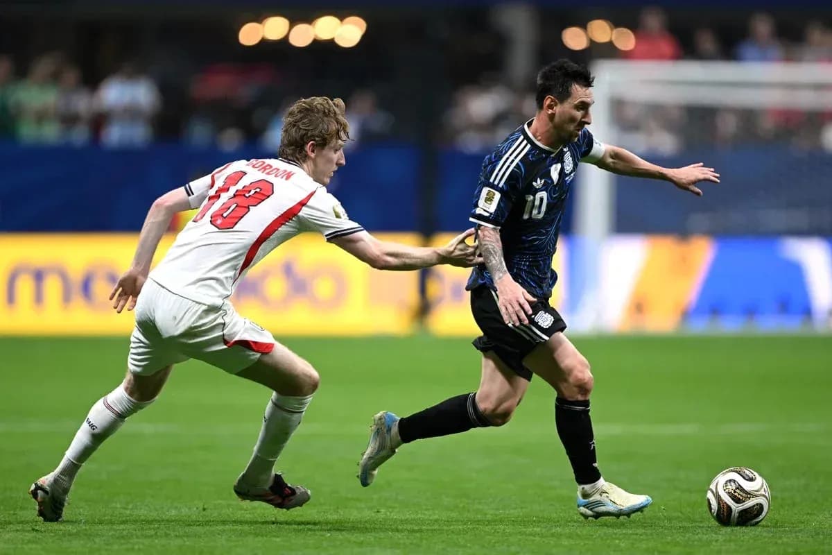 Player dribbling the ball while being pursued Player dribbling the ball while being pursued