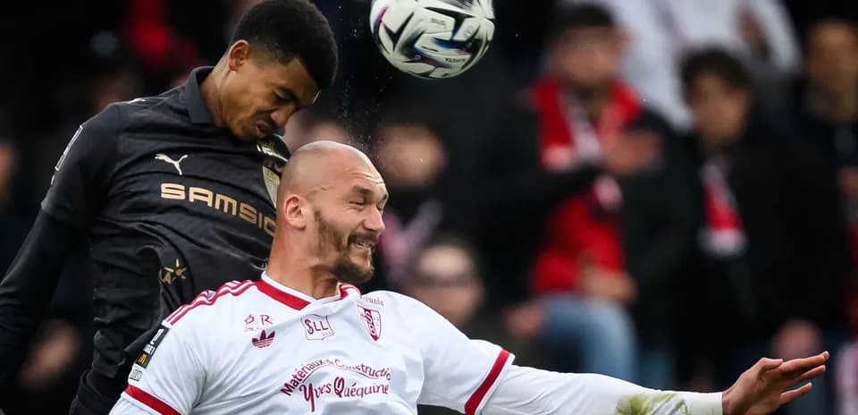Two players contesting a header during match Two players contesting a header during match