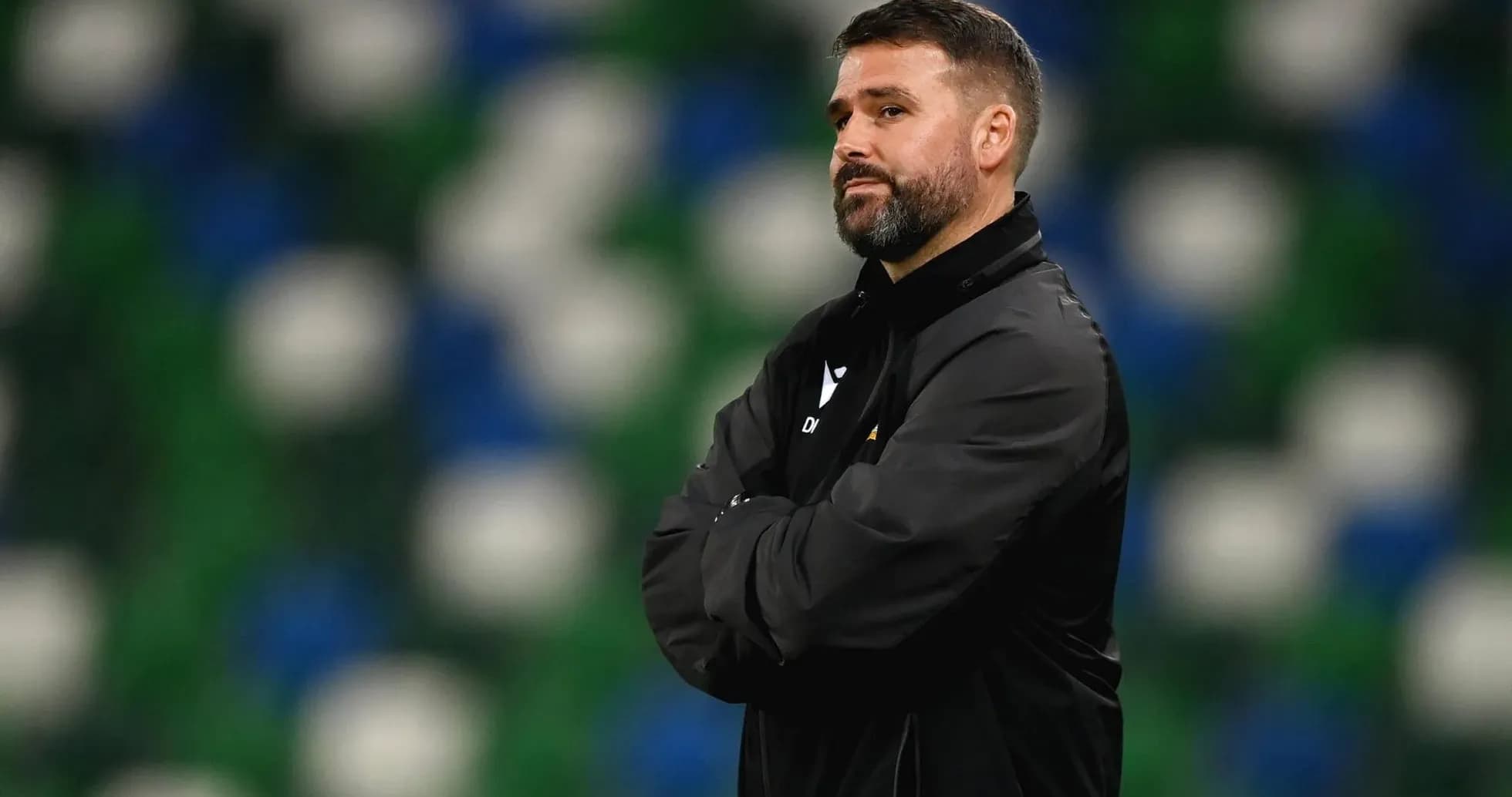 Football manager observing the game from the sidelines Football manager observing the game from the sidelines