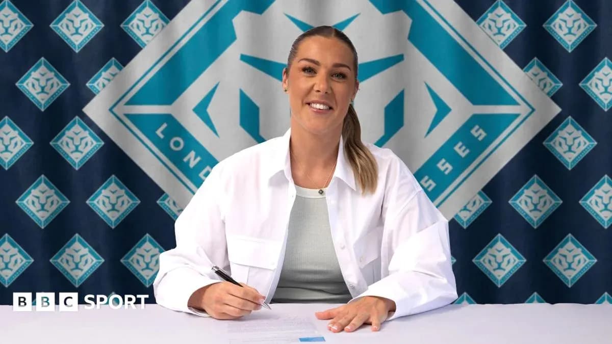 Athlete signing contract at promotional event Athlete signing contract at promotional event