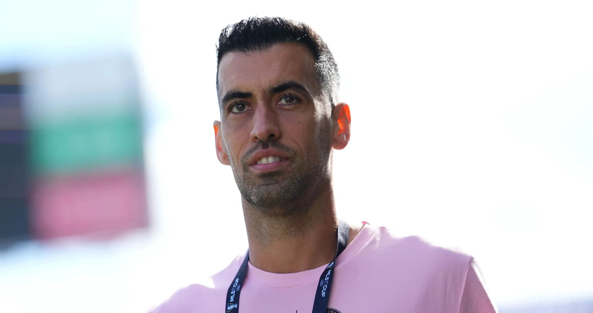 Player wearing a pink shirt with lanyard Player wearing a pink shirt with lanyard