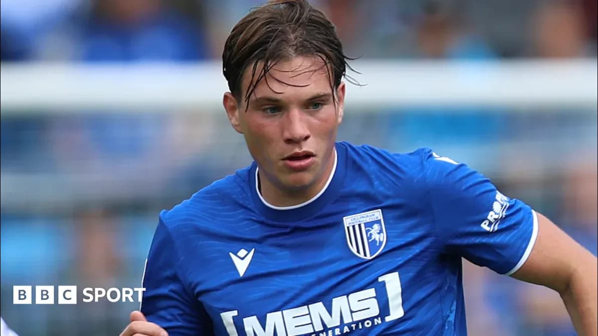 Gillingham FC player running during a match Gillingham FC player running during a match