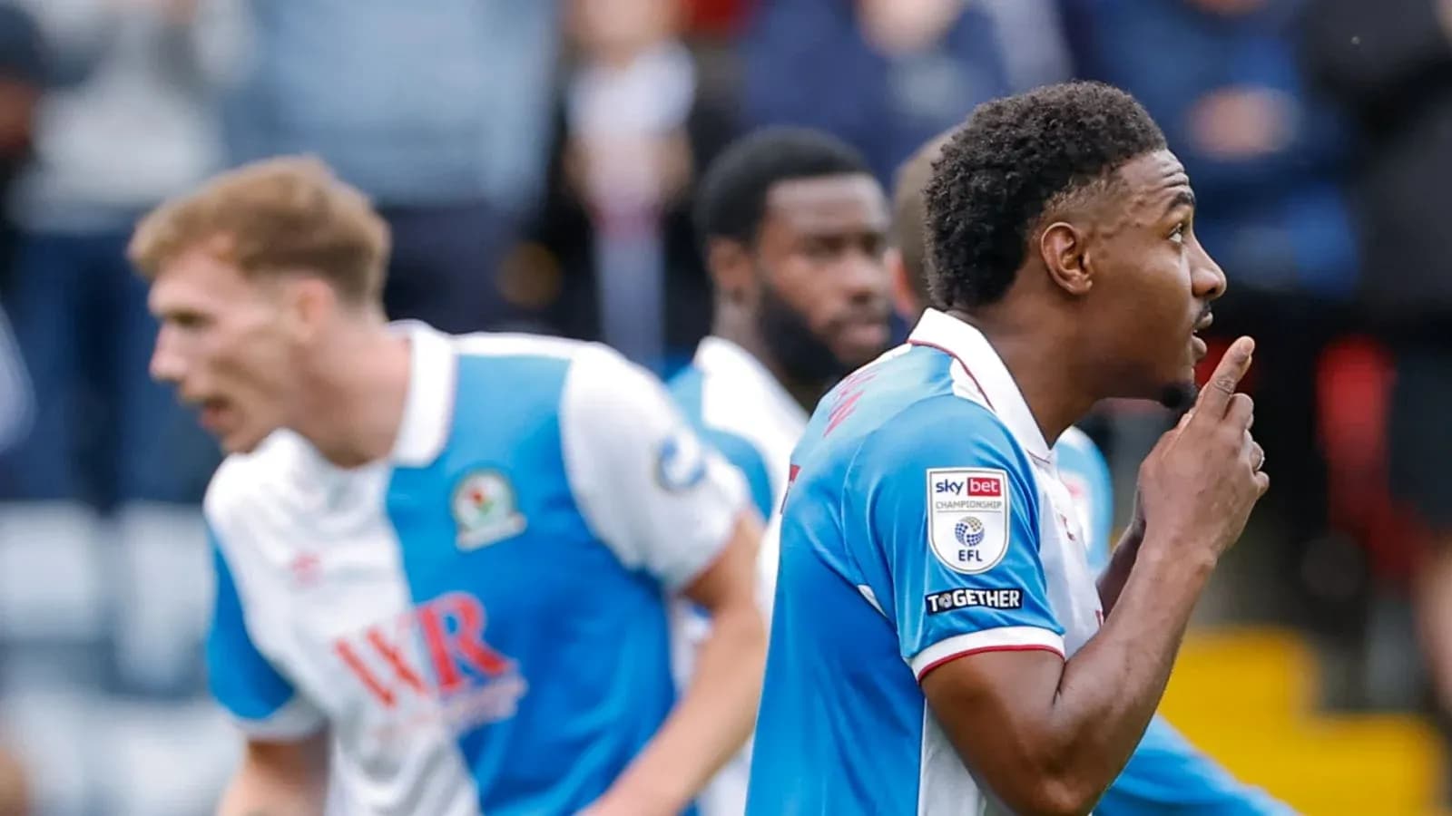 Player celebrating a goal with shushing gesture Player celebrating a goal with shushing gesture