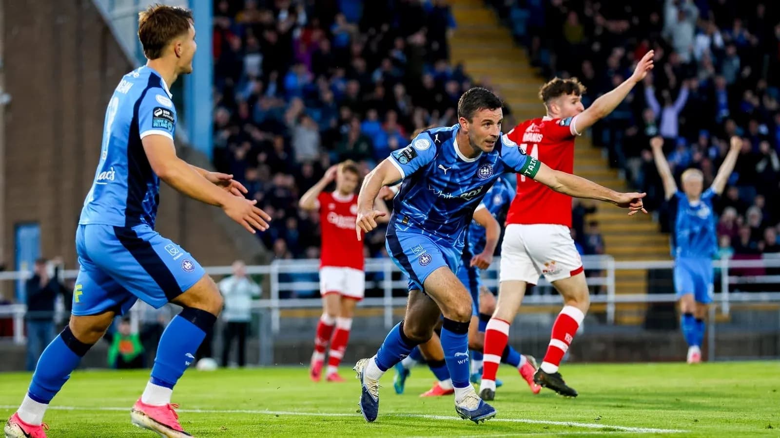 Player celebrating a goal during a football match Player celebrating a goal during a football match