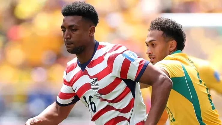 USA player evading an opponent during match USA player evading an opponent during match
