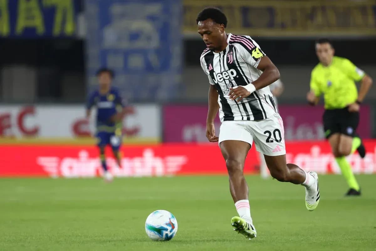 Juventus player running with ball during match Juventus player running with ball during match