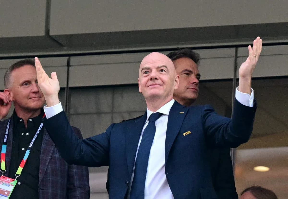 FIFA president gesturing in stadium box FIFA president gesturing in stadium box