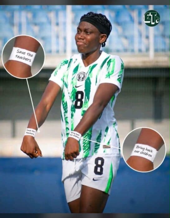 Football player displaying wristbands with messages Football player displaying wristbands with messages