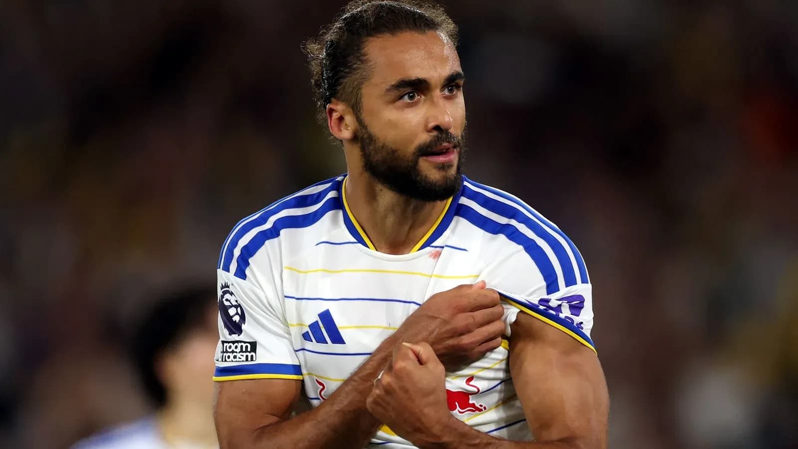 Player adjusting his shirt during a match Player adjusting his shirt during a match