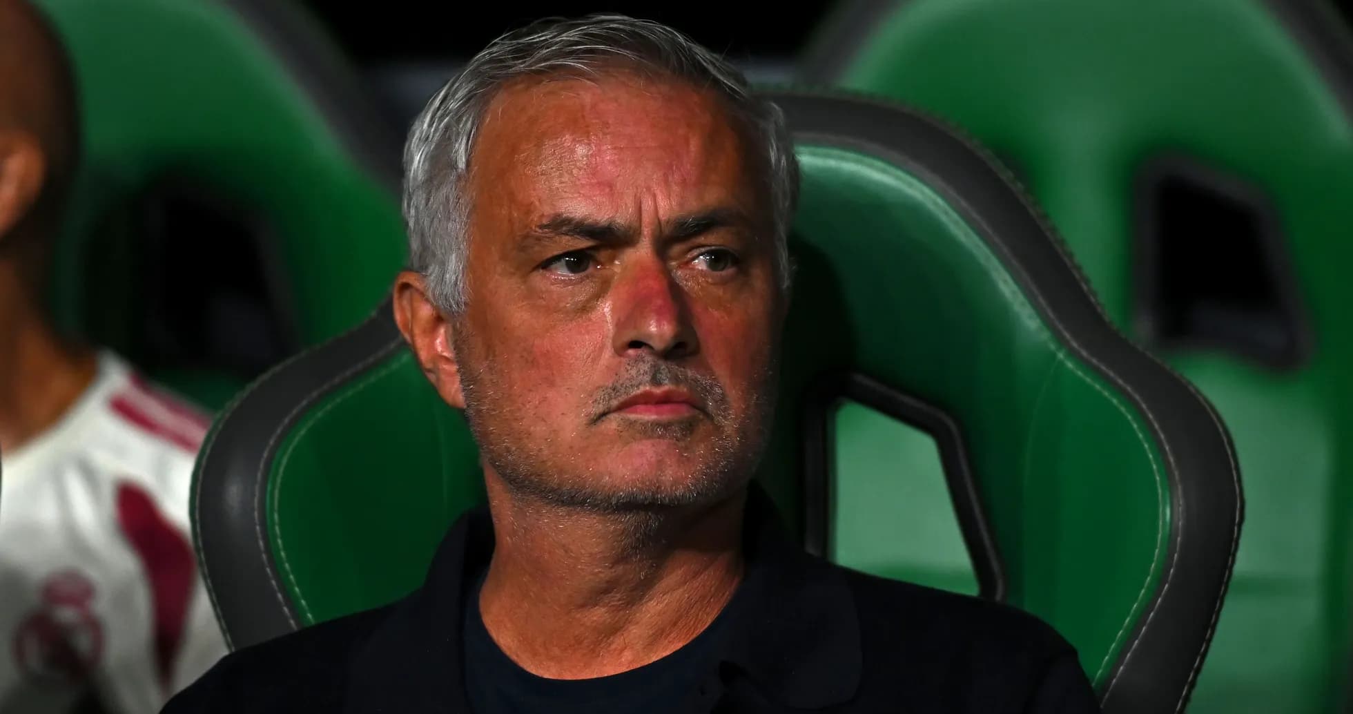 Jose Mourinho seated on the team bench Jose Mourinho seated on the team bench
