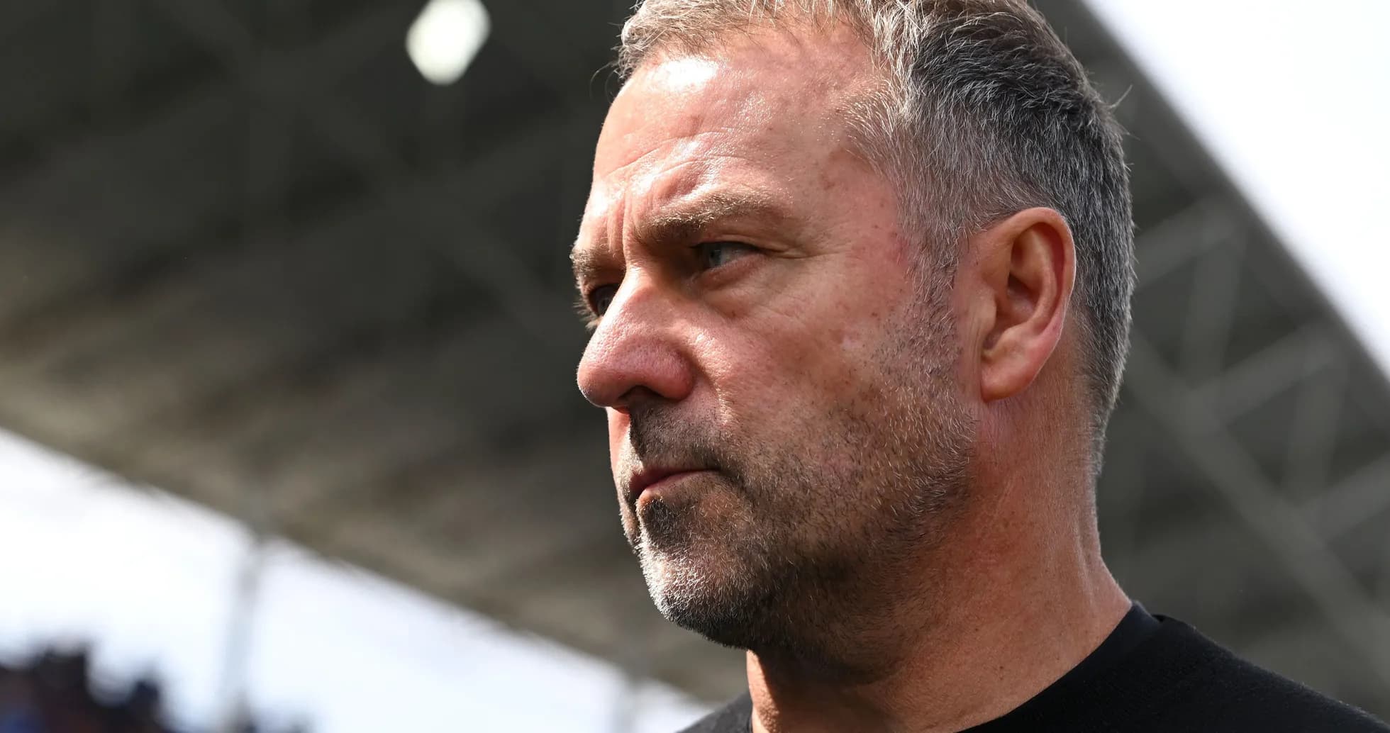 An intense-looking football manager on the sidelines An intense-looking football manager on the sidelines