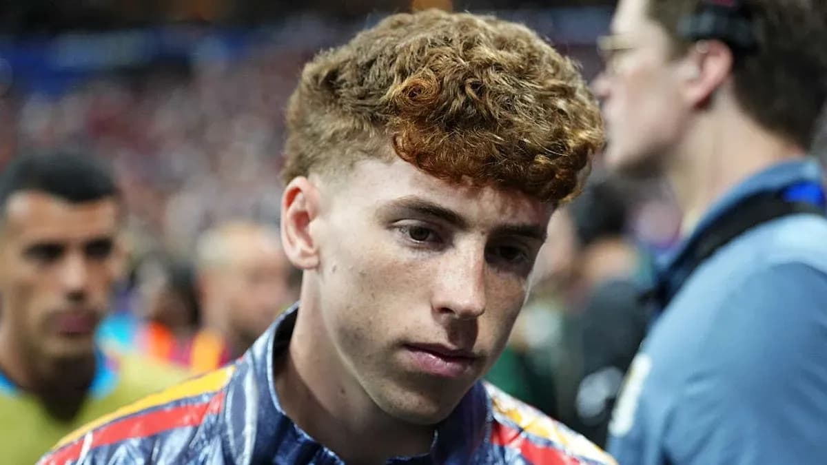 Young player walking off the pitch after match Young player walking off the pitch after match