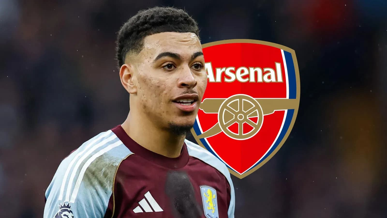 Futbolçu Arsenal loqosunun arxasında dayanır Futbolçu Arsenal loqosunun arxasında dayanır