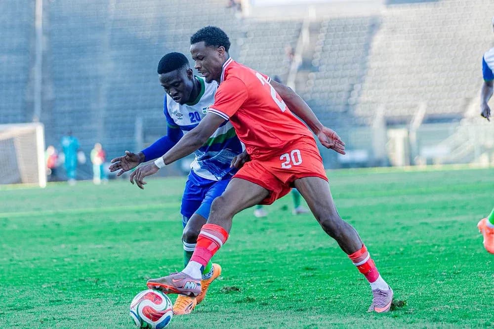 Two players competing for the ball during match Two players competing for the ball during match