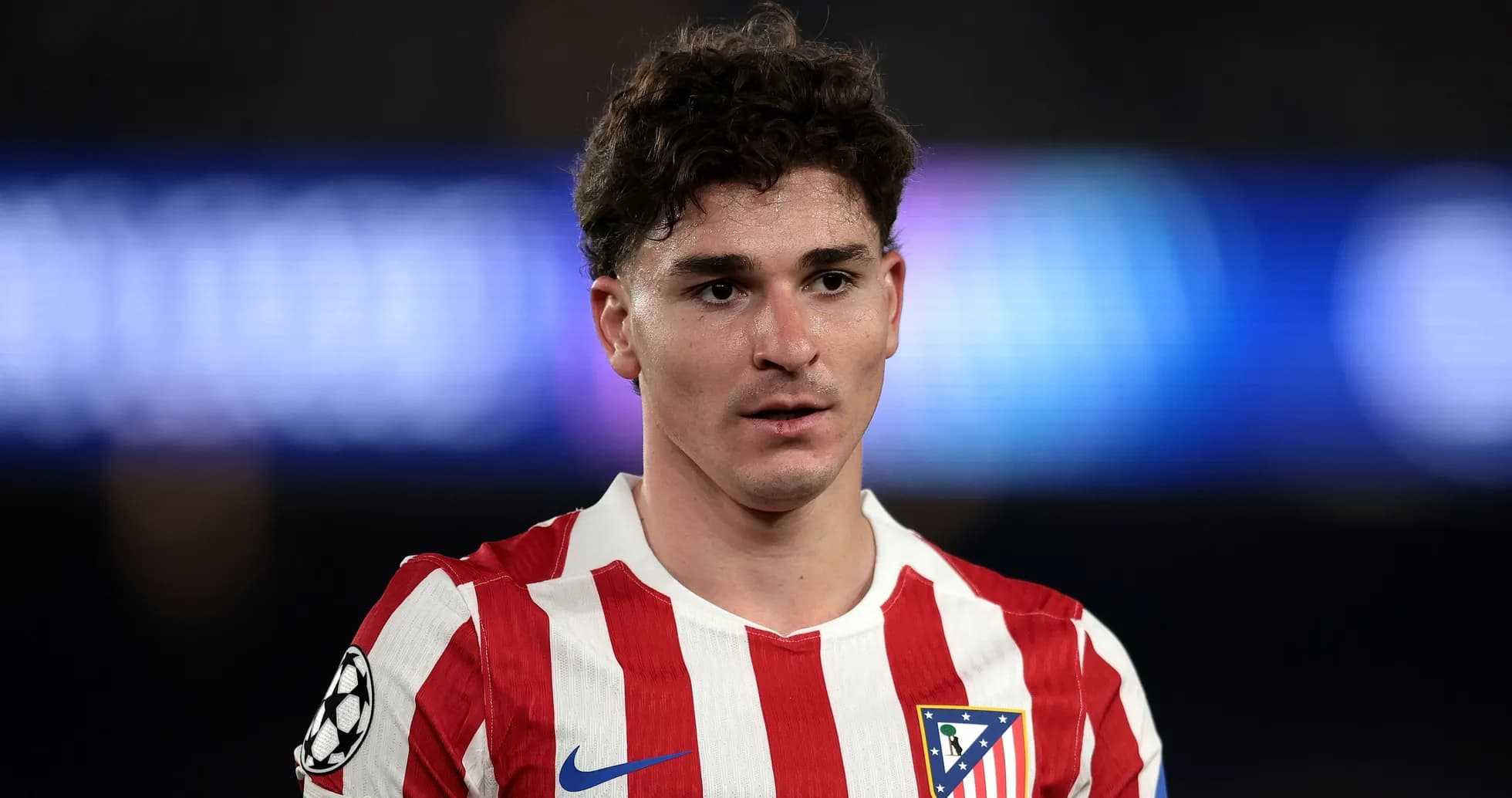 Atletico Madrid player in red and white jersey Atletico Madrid player in red and white jersey