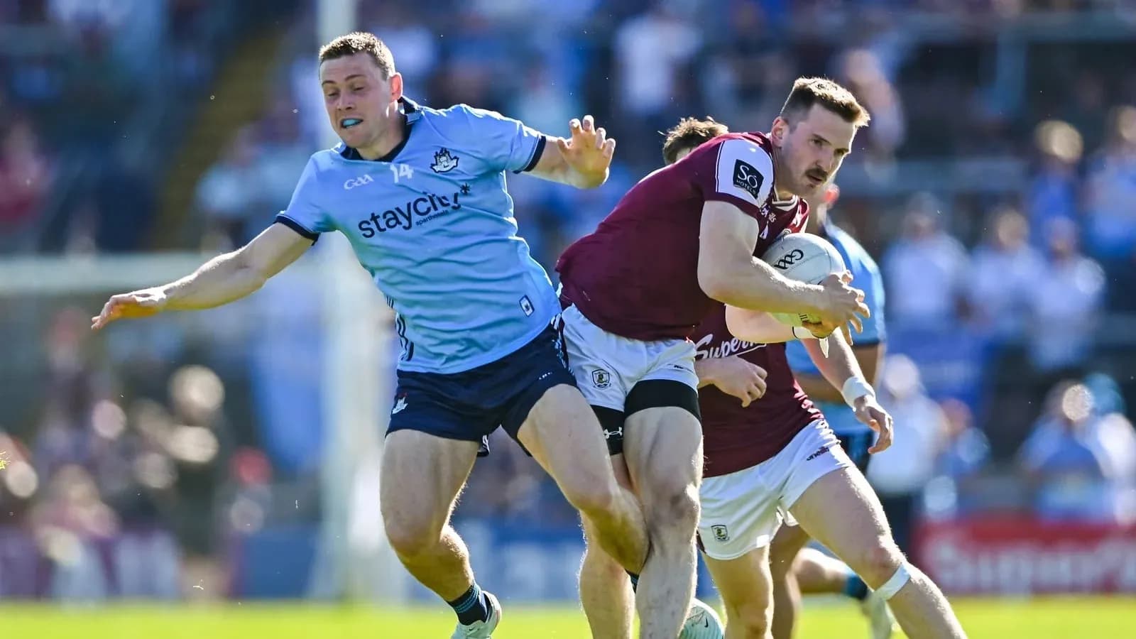 Player attempting to tackle opponent during match Player attempting to tackle opponent during match
