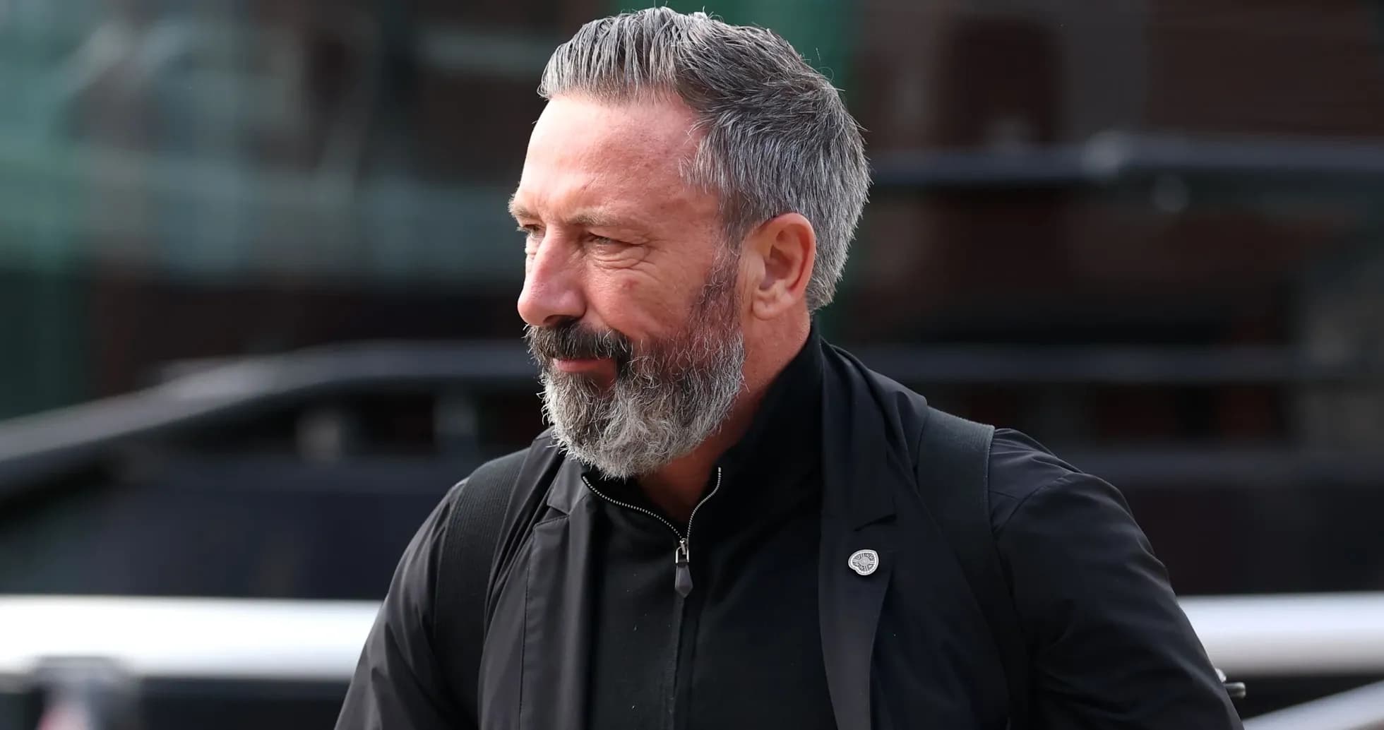 Man with gray beard walking outdoors Man with gray beard walking outdoors