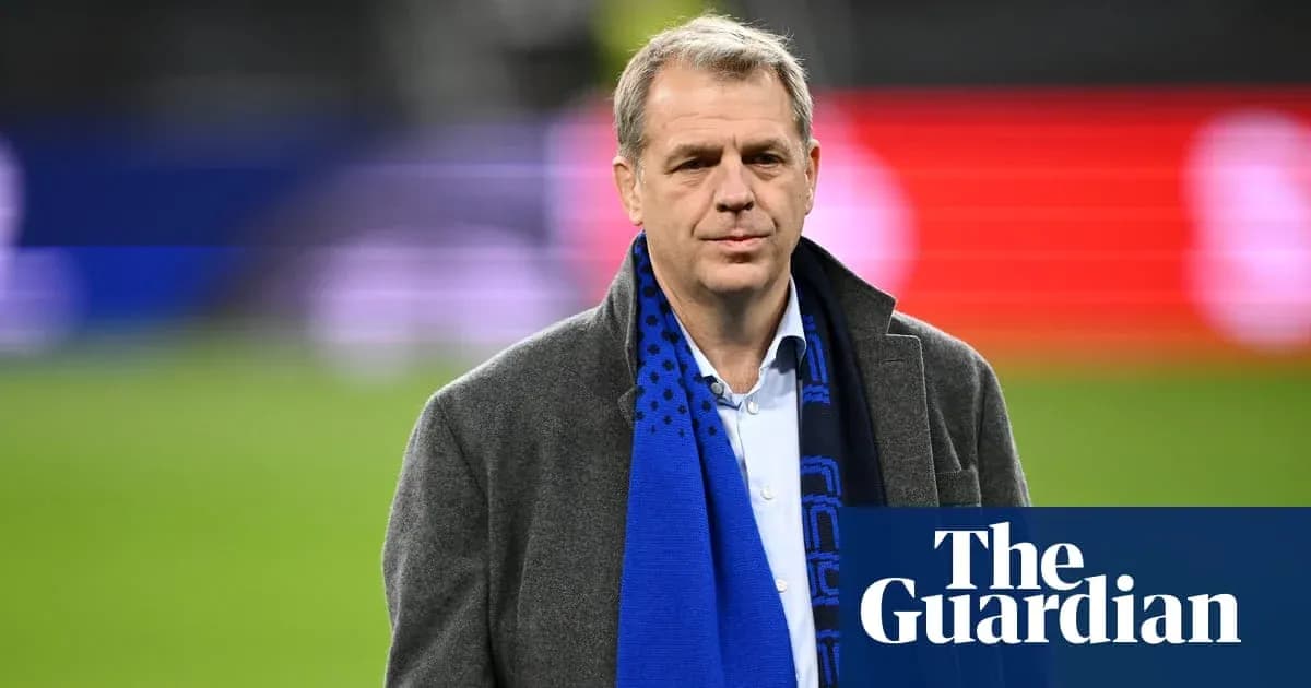 Person wearing a coat and scarf on field Person wearing a coat and scarf on field