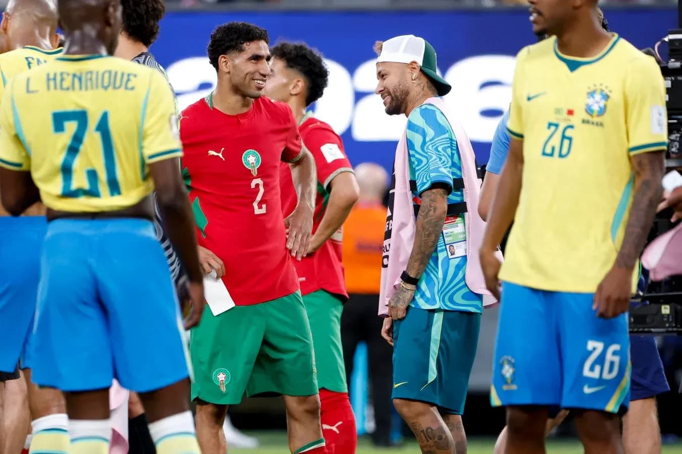 Players interacting on the field after match Players interacting on the field after match