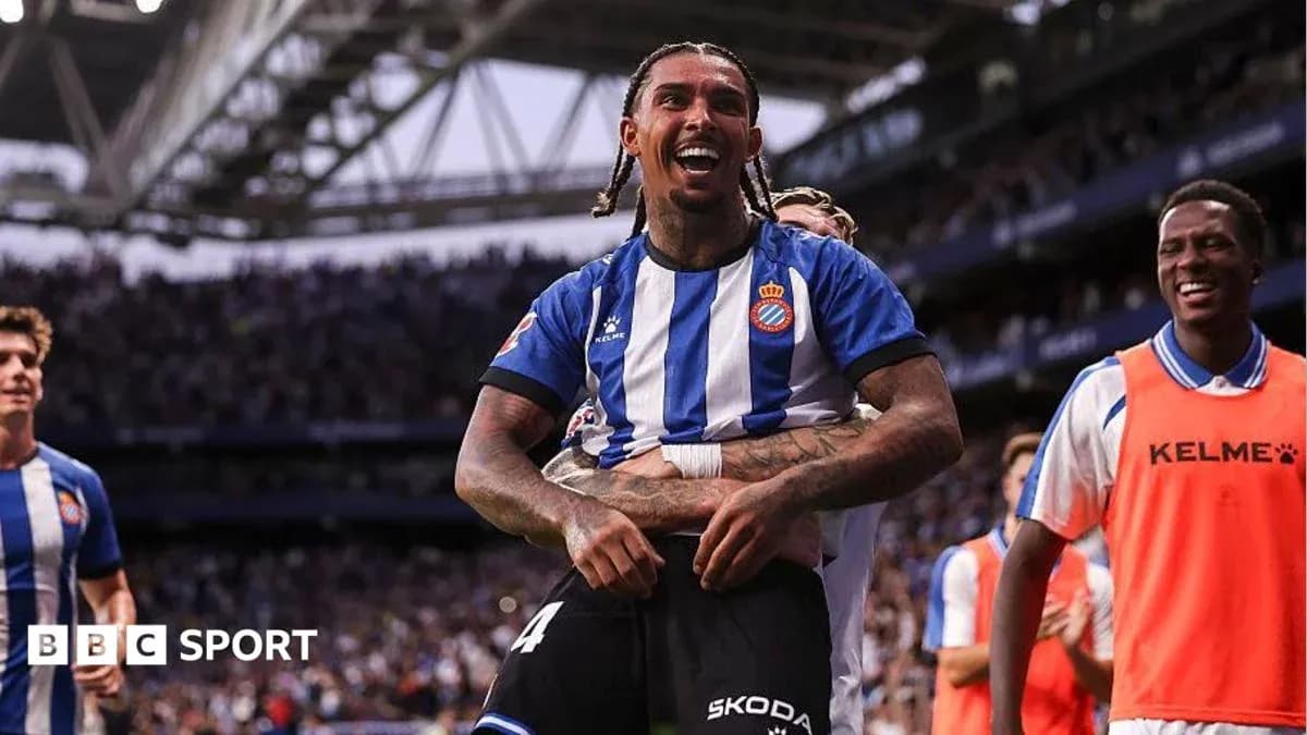 Espanyol players celebrating a goal on the field Espanyol players celebrating a goal on the field