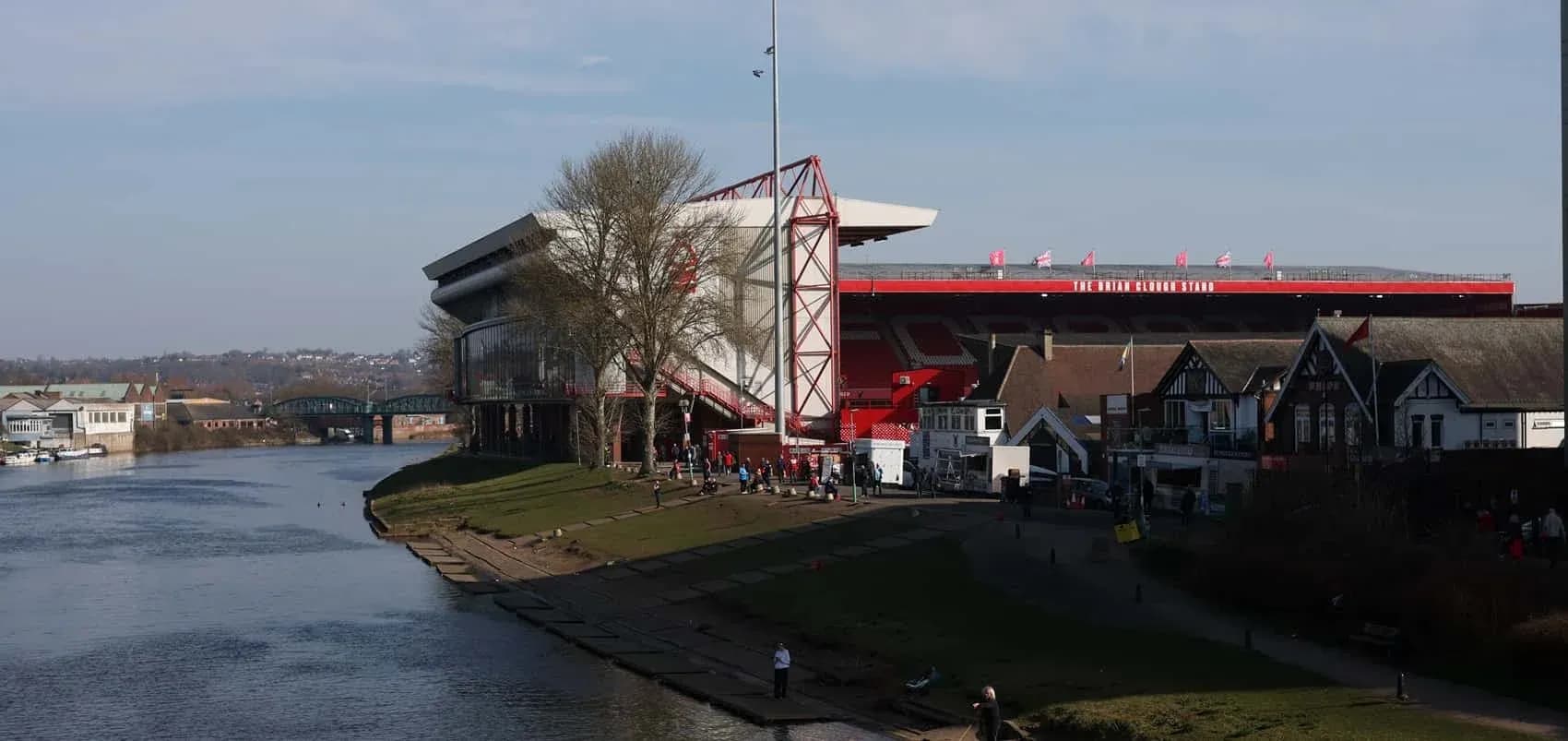 The City Ground stadium by the river with spectators The City Ground stadium by the river with spectators