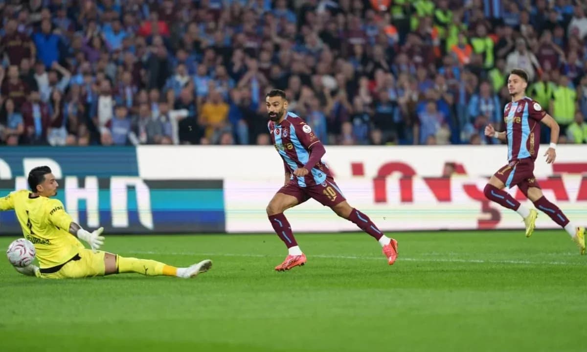Player scoring against goalkeeper during match Player scoring against goalkeeper during match