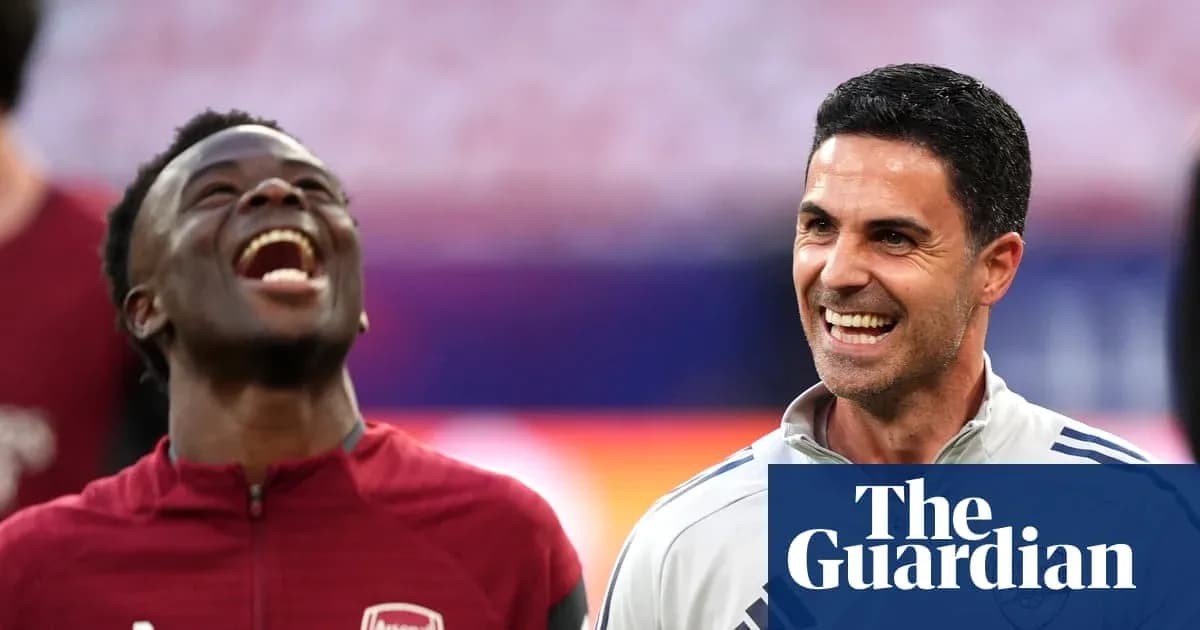 Two Arsenal players smiling during warm-up session Two Arsenal players smiling during warm-up session