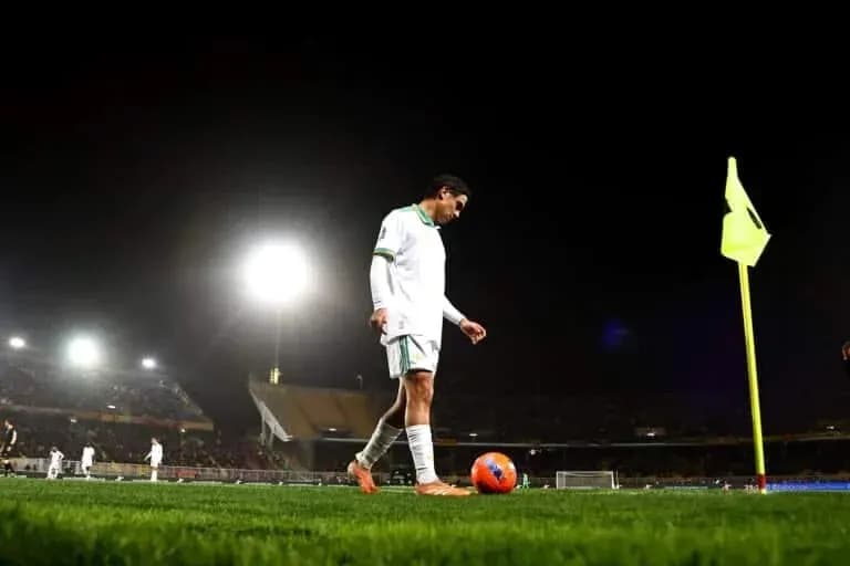 Player preparing for corner kick at night match Player preparing for corner kick at night match